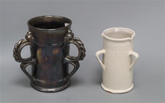 An unusual Dicker ware black lustre three handled tyg and a similar three handled tin glazed pot tallest 18cm